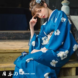 Femme en kimono bleu, élégance japonaise, moment de sérénité dans un cadre traditionnel.