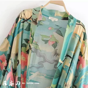 Kimono floral teal et aqua, élégant, avec motifs roses et corail, idéal pour toutes occasions.